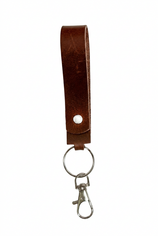 Handmade brown leather keychain loop by Killer Vibez featuring a durable key ring and lobster clasp, measuring approximately 5.5 inches long.